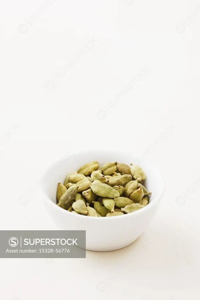 A bowl of cardamon capsules