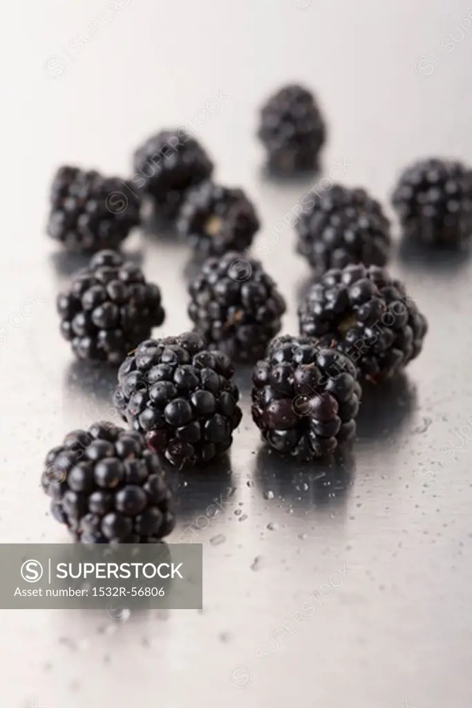 Blackberries on a metal surface