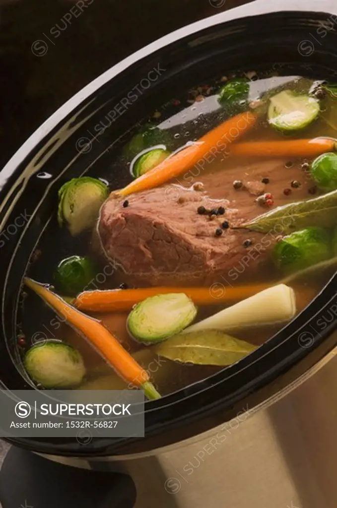 Cooked beef in vegetable broth
