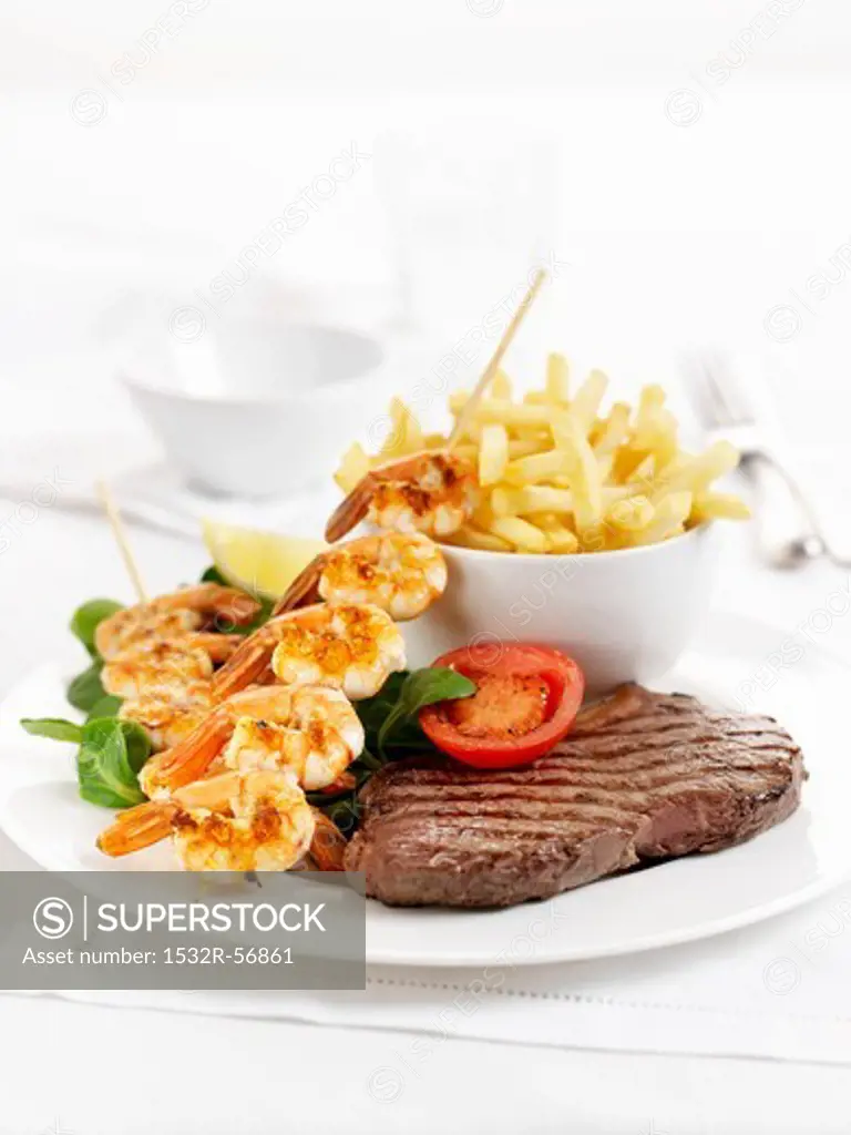 Surf and Turf (beef steak and a prawn kebab) with chips