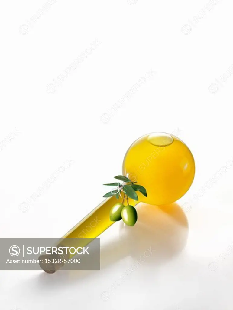 A bottle of olive oil laying on its side