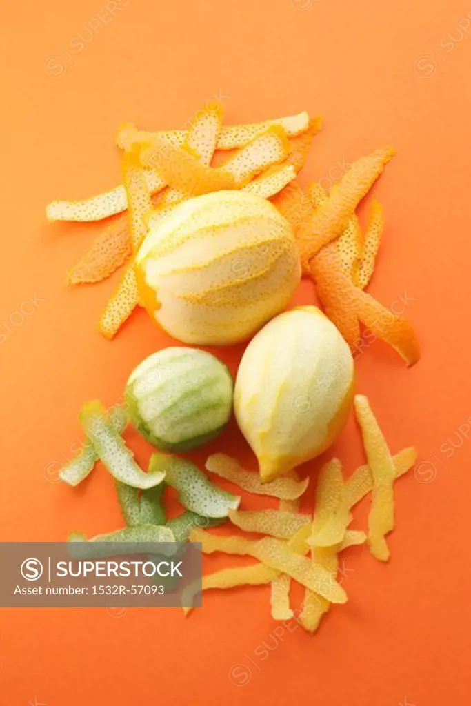Peeled orange, lime and lemon and their peel