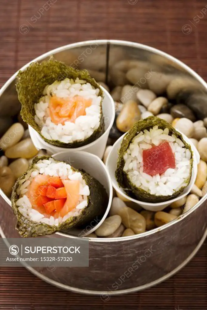 Temaki sushi with tuna, salmon and carrot sticks (Japan)