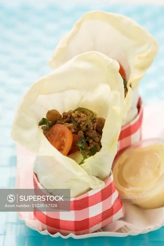 Serbian white cabbage wraps with minced meat and tomatoes