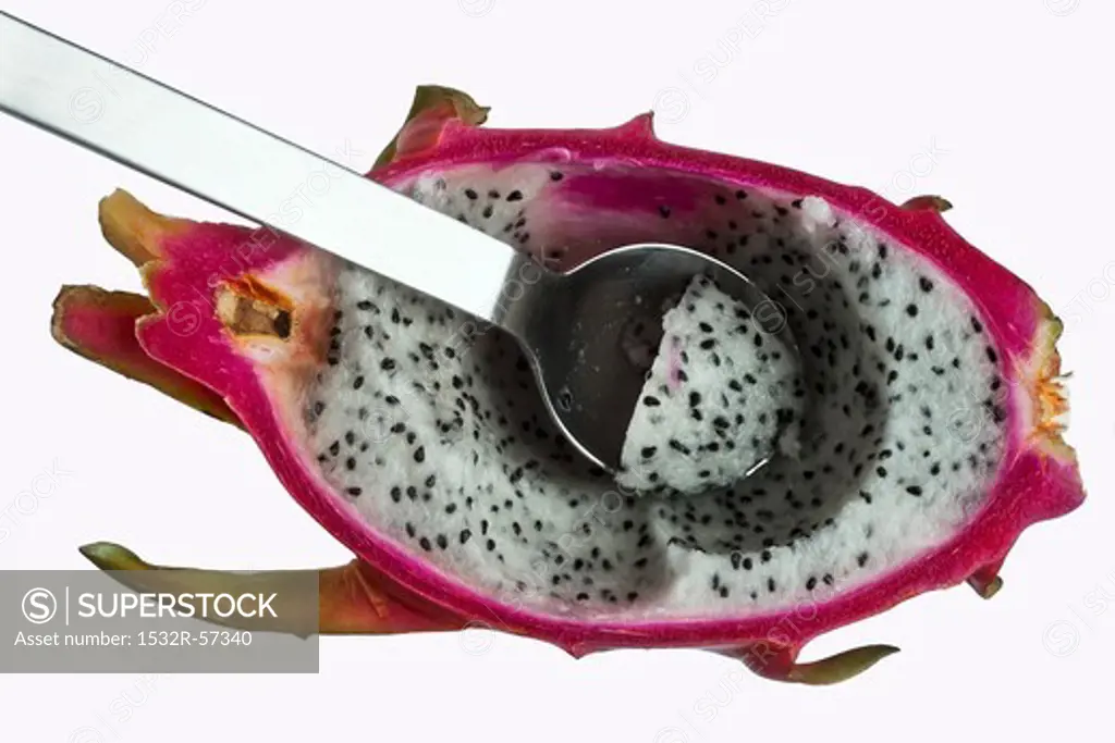 Half a dragonfruit with a spoon