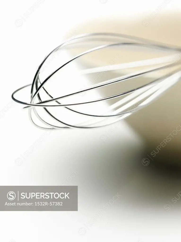 A whisk in a bowl