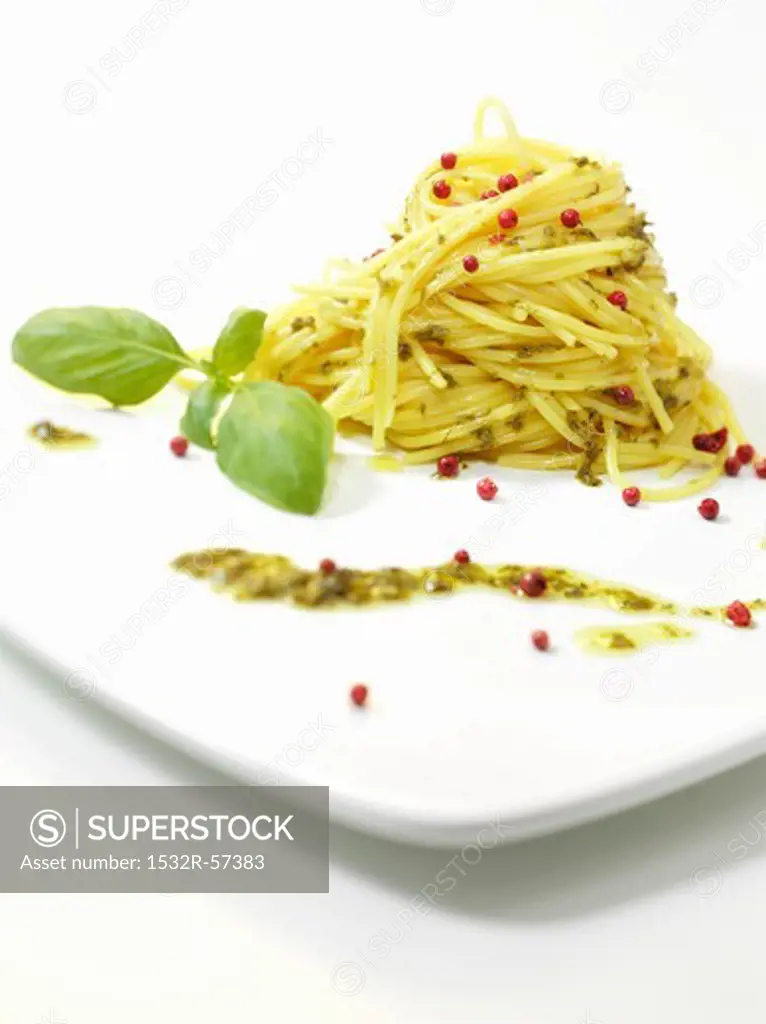 Spaghetti with pesto and pink peppercorns