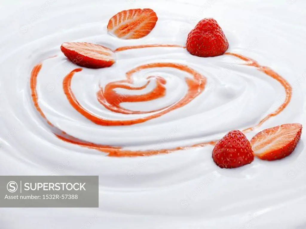 Natural yogurt with strawberries and strawberry sauce