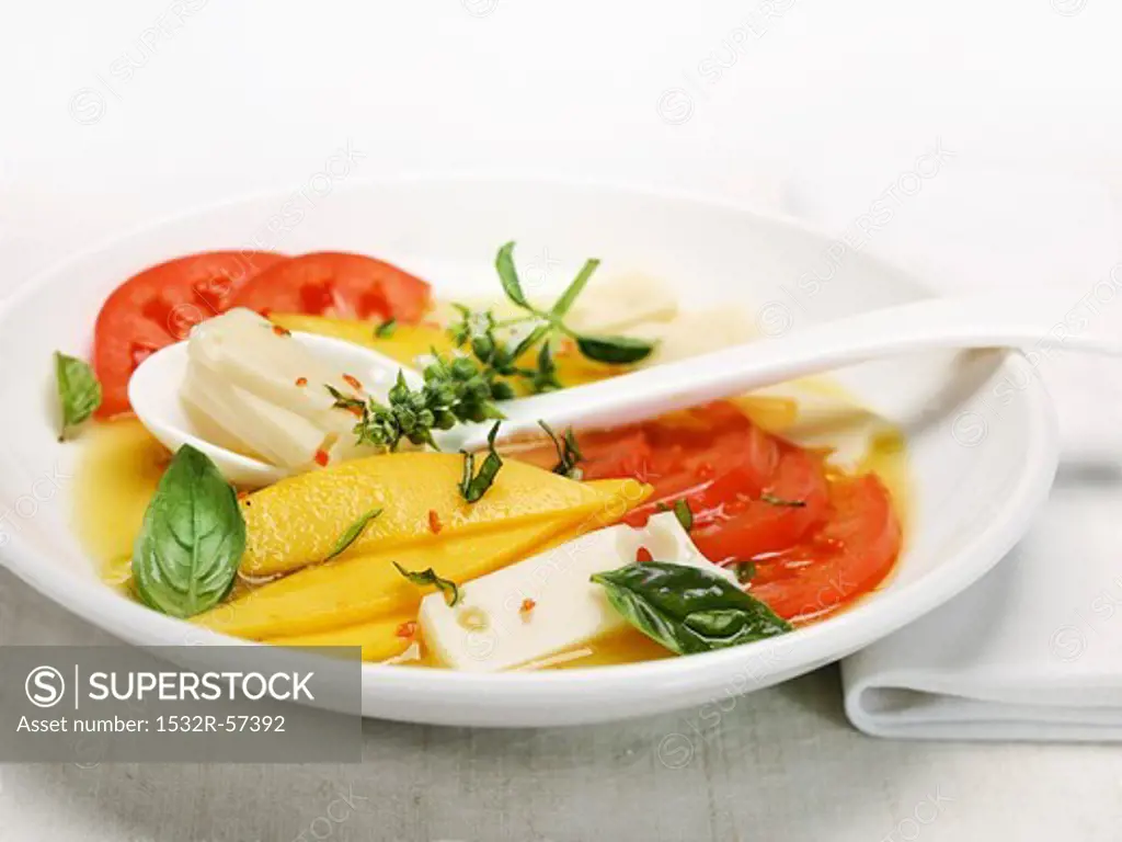 Tomato salad with cheese and mango