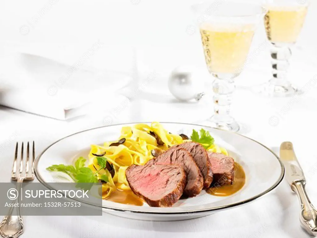Veal fillet with an orange and vodka sauce and truffle pasta
