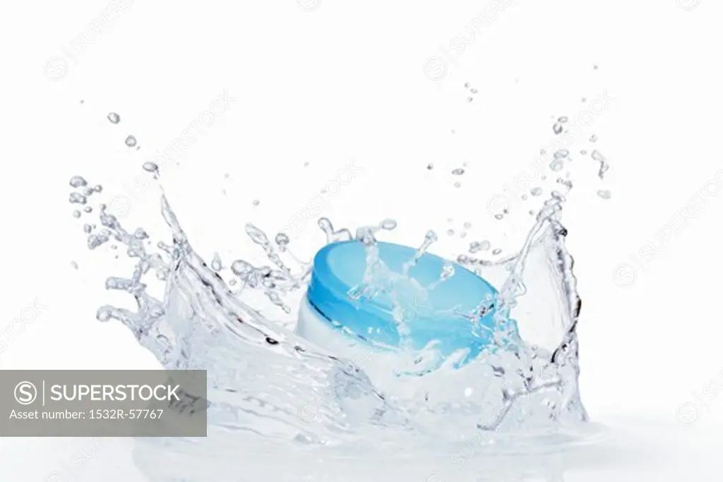 A cream jar in water