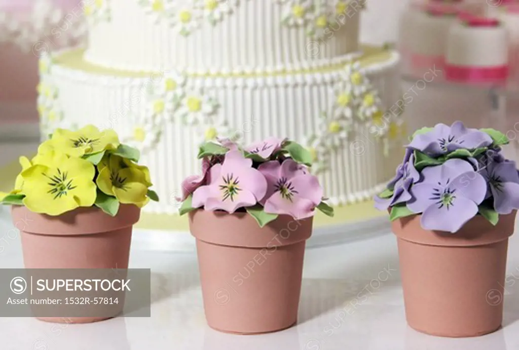 Wedding cake and artificial pansies