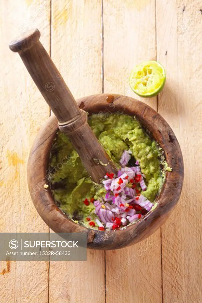 Guacamole with onions in a mortar