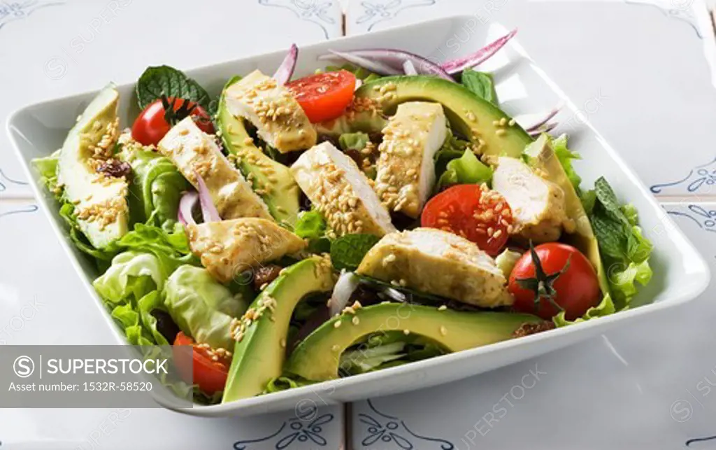 Chicken salad with avocados and sesame seeds
