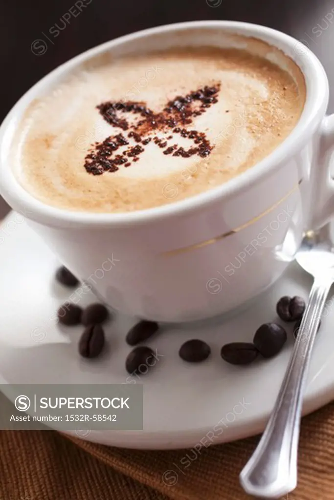 Cappuccino and coffee beans