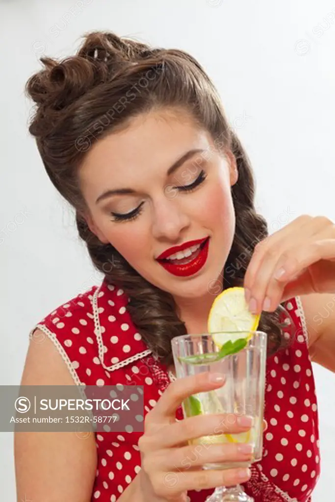 A retro-stlye girl drinking lemonade