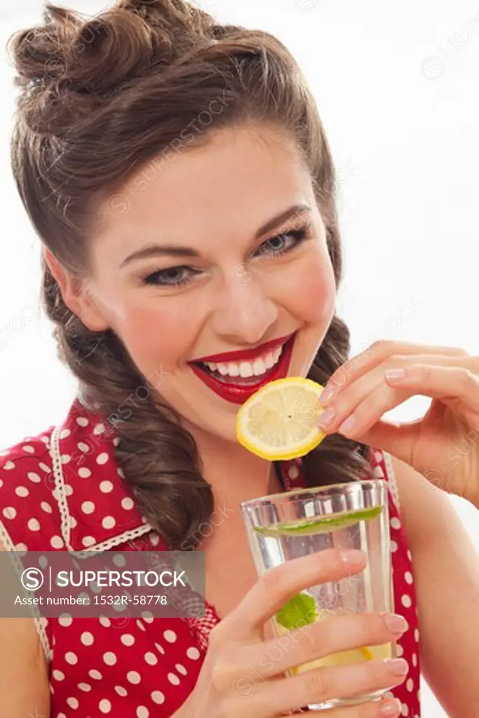 A retro-stlye girl drinking lemonade