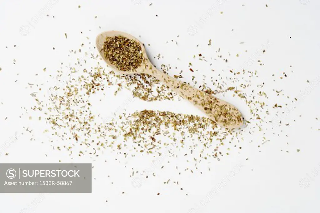 Dried oregano on a spoon and next to it