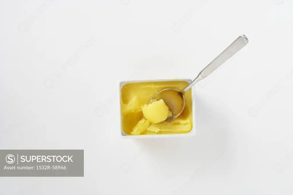 Clarified butter in a bowl with a spoon