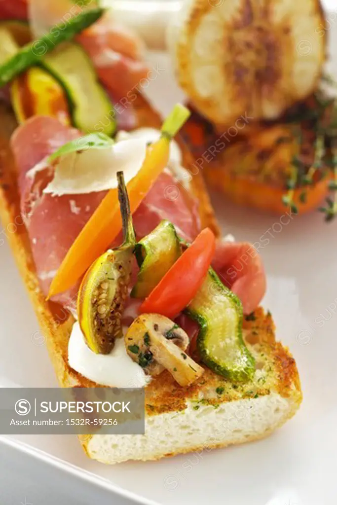 Baguette with ham, cheese and grilled vegetables