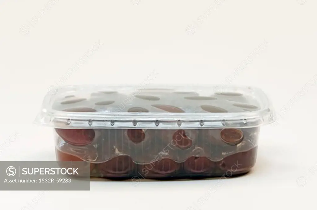 Kalamata olives in a plastic container