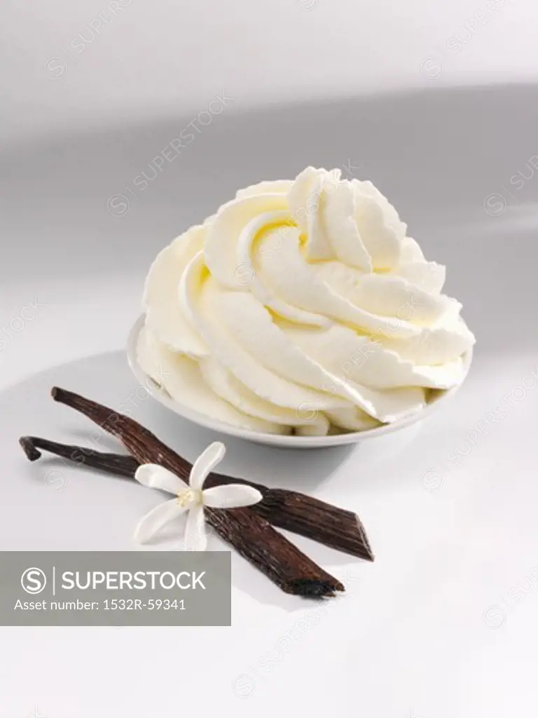 Vanilla cream, vanilla pods and a vanilla flower