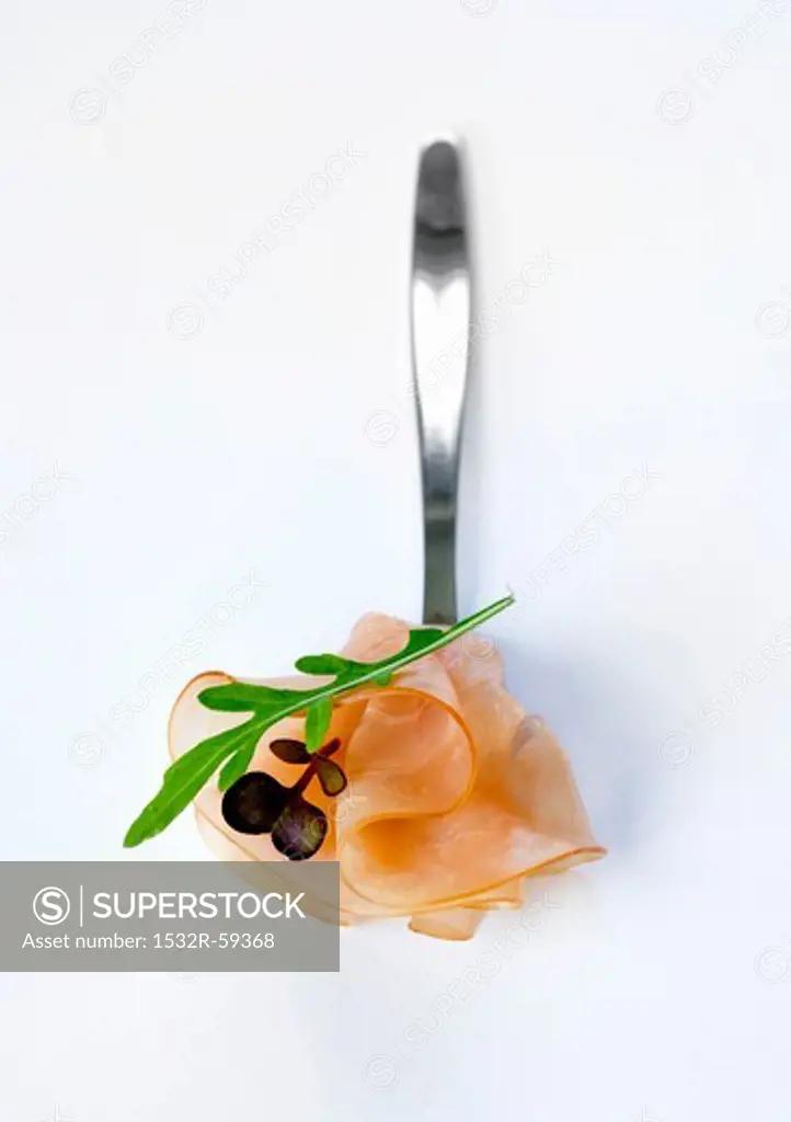 Slightly smoked fillet of ham with rocket on a spoon