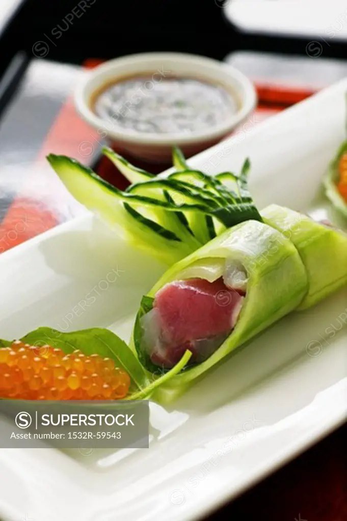 Cucumber rolls with tuna fish and char caviar with a wasabi dip (Asia)
