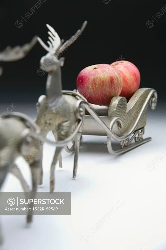 Red apples on a Christmas sleigh