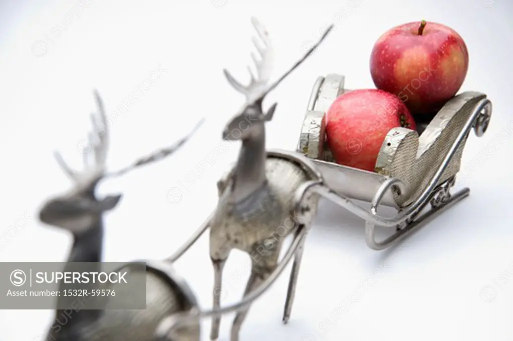 Red apples in a Christmas sleigh