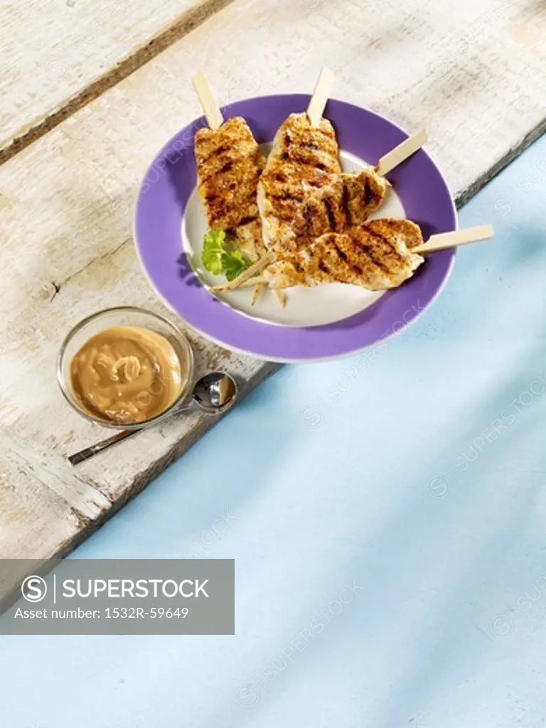 Grilled chicken satay kebabs with a peanut dip
