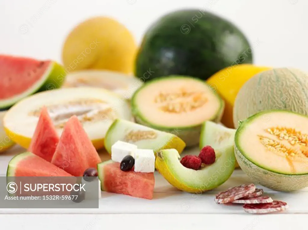 Various types of melon with feta and salami