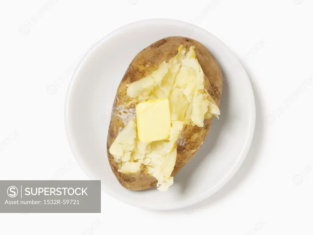 Baked Potato Sliced Open with a Pat of Butter