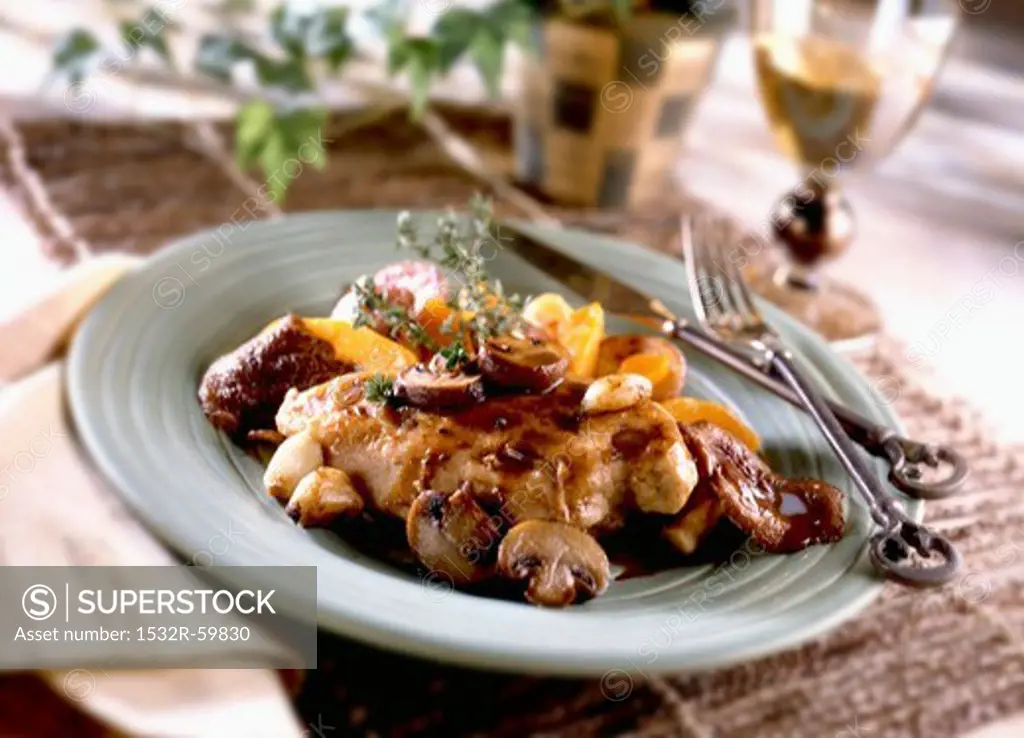 Balsamic Chicken with Mushrooms on a Plate; Fork and Knife