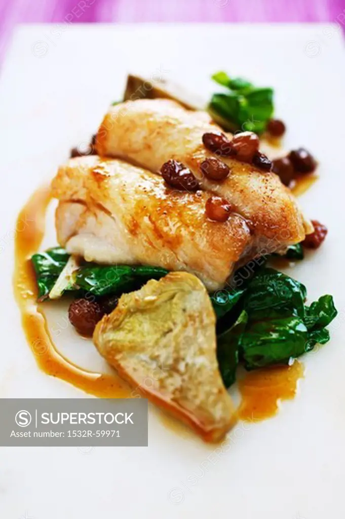 Fillet of bream with chard, artichokes and raisins