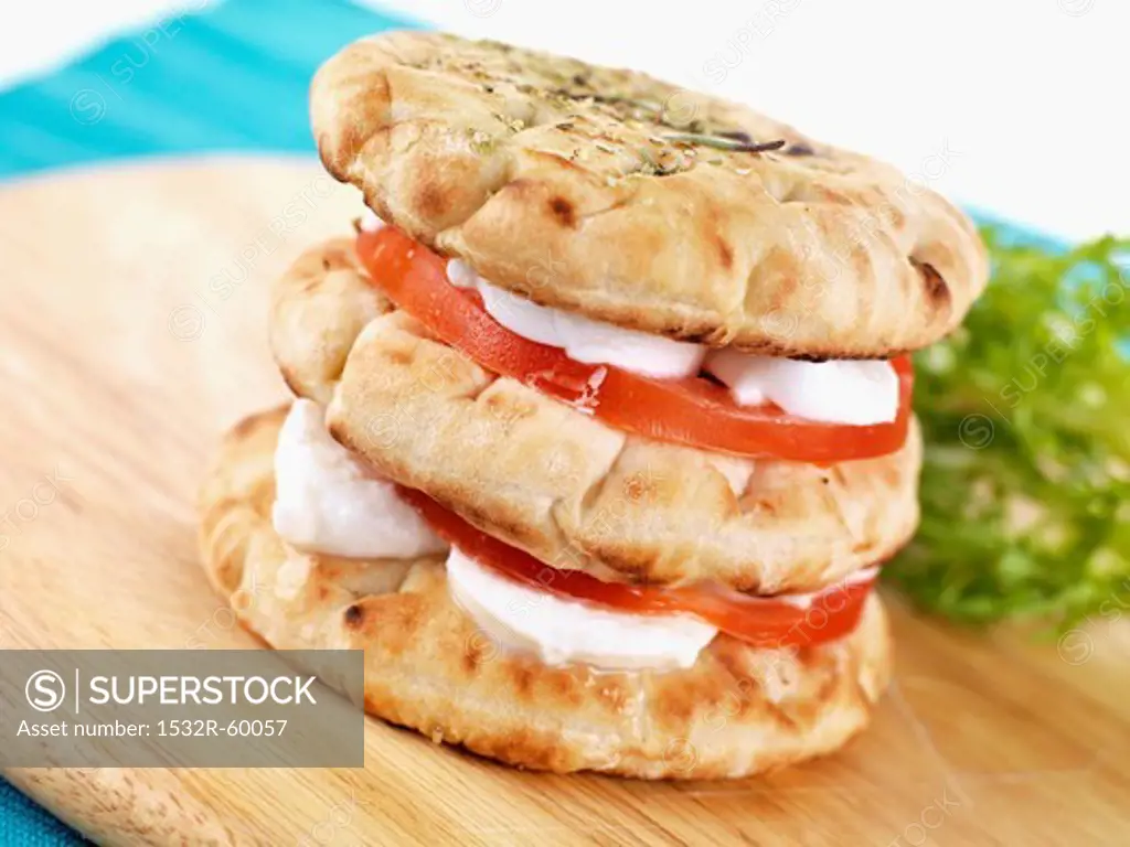 Pita bread sandwich with goat's cheese and tomatoes