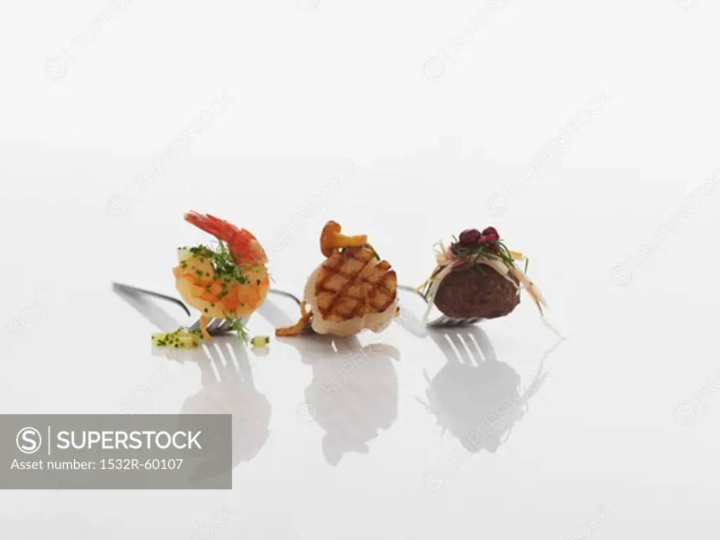 Various appetizers on forks