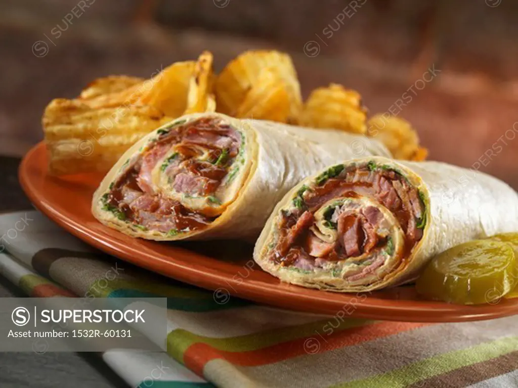 Brisket Wrap with American Cheese, Chipotle Mayonnaise and Lettuce; Chips and Pickle