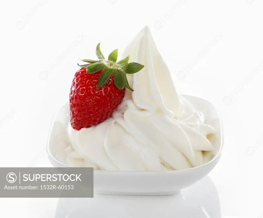 Yogurt ice cream, garnished with fresh strawberries