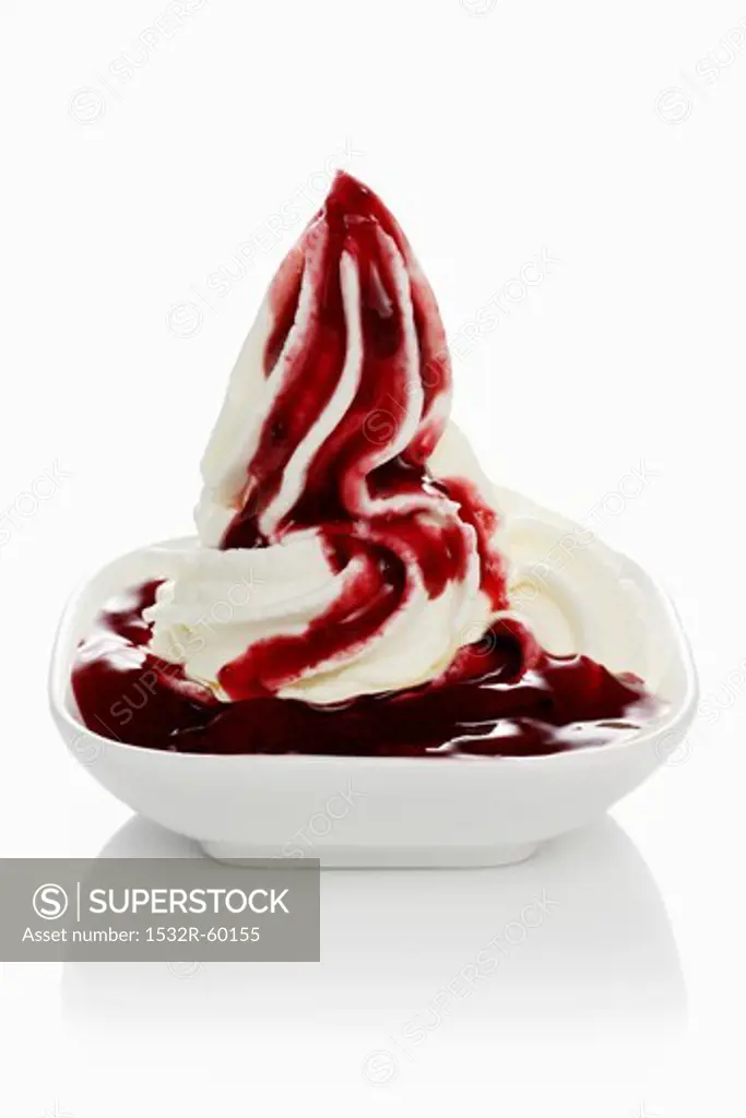 Yogurt ice cream with fruit sauce