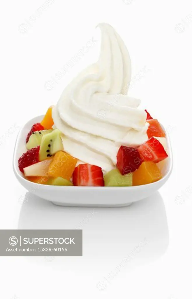 Yogurt ice cream garnished with mixed fruit
