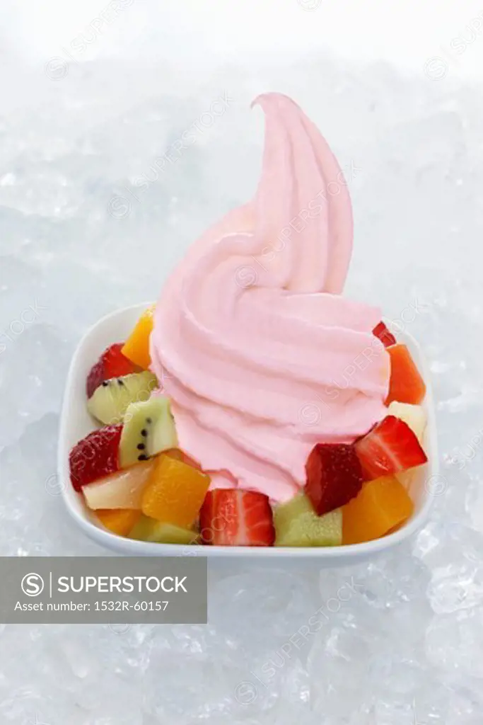 Strawberry yogurt ice cream garnished with mixed fruit