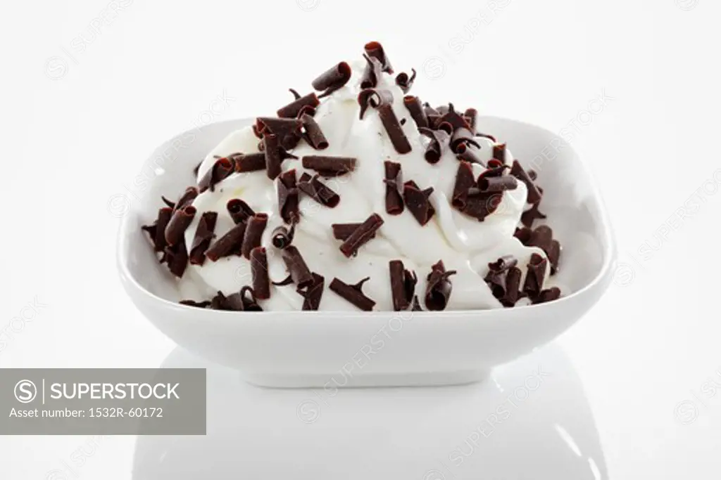 Yogurt ice cream garnished with chocolate curls