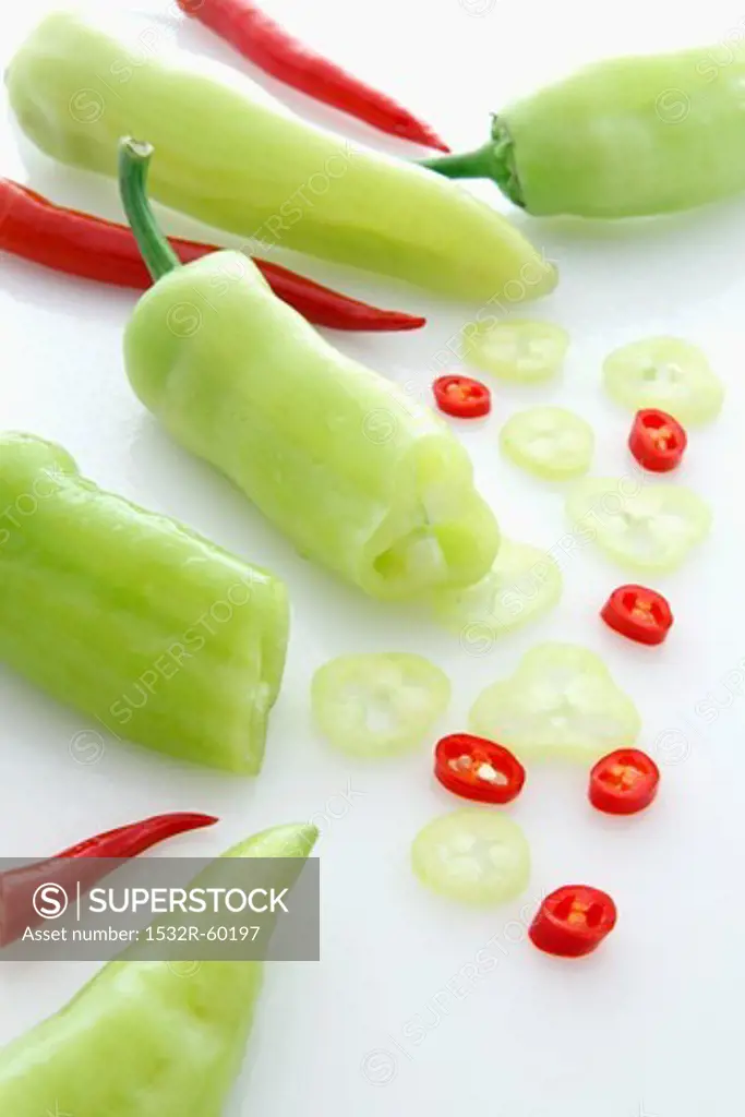 Pointed peppers and red chilli peppers, partially sliced