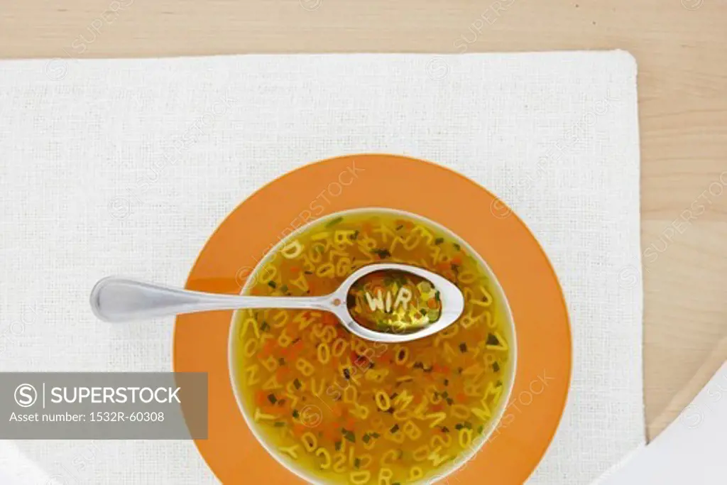 Clear broth with vegetables and alphabet noodles