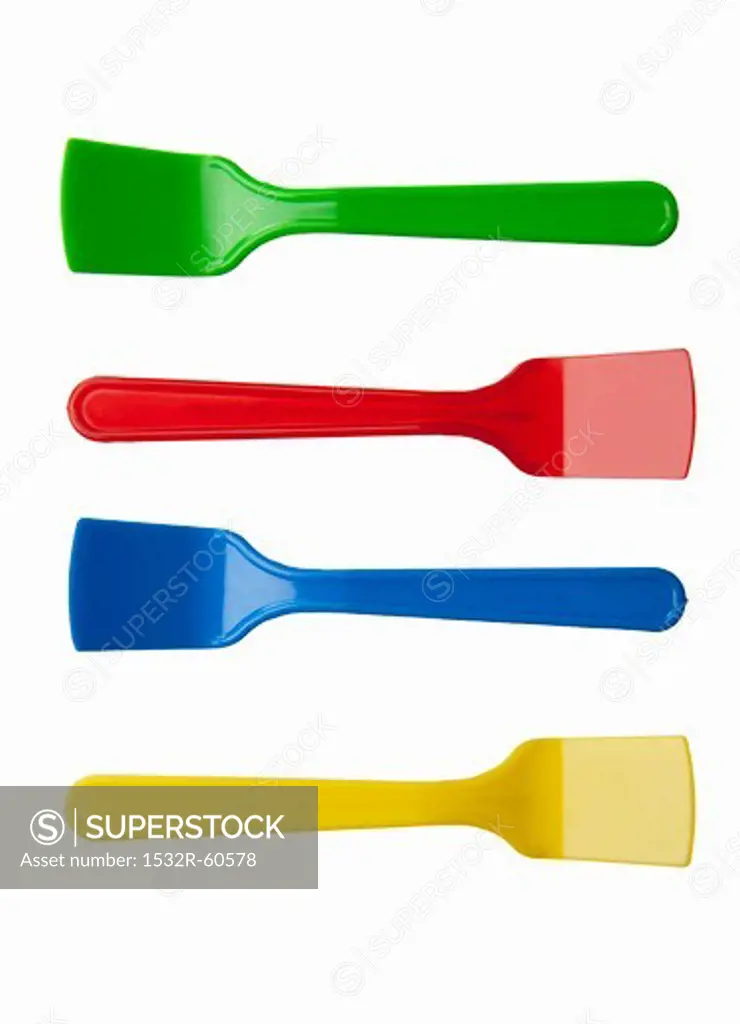 Four brightly colored ice cream spoons