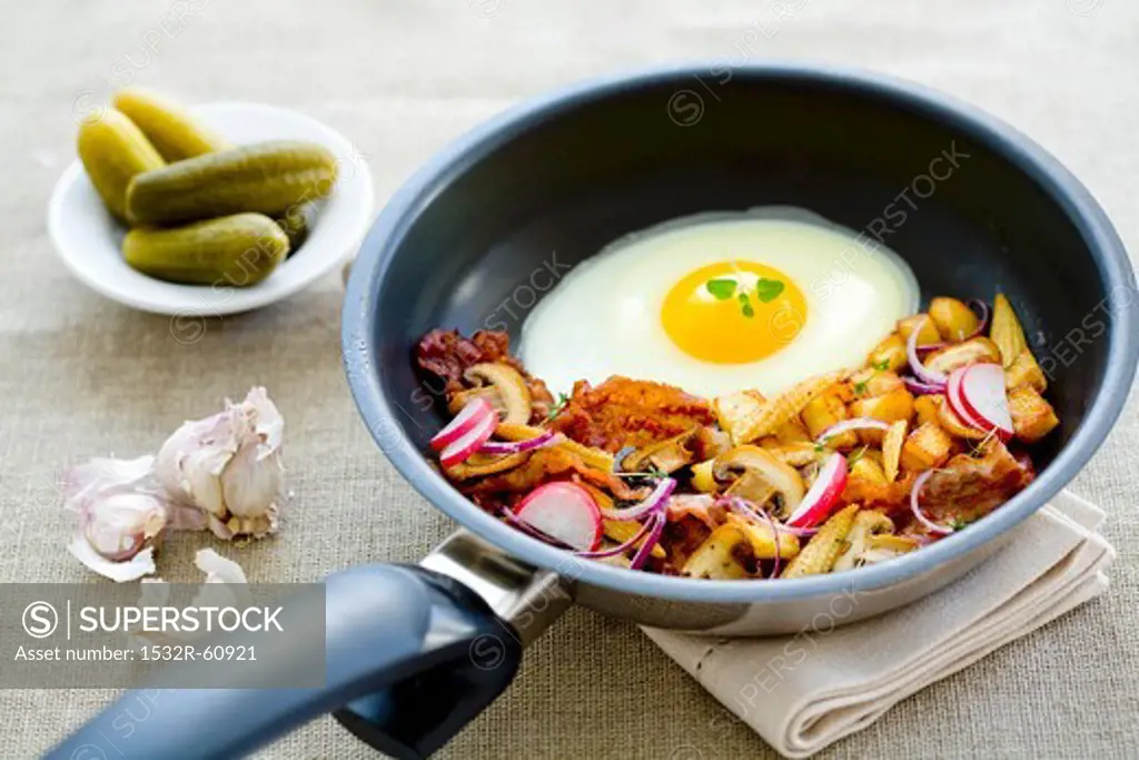 A farmer's breakfast with fried potatoes and a fried egg