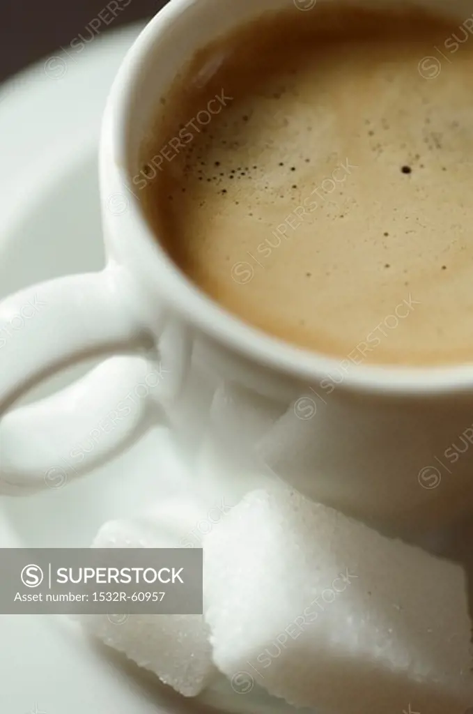 Espresso in a White Cup with Sugar Cubes