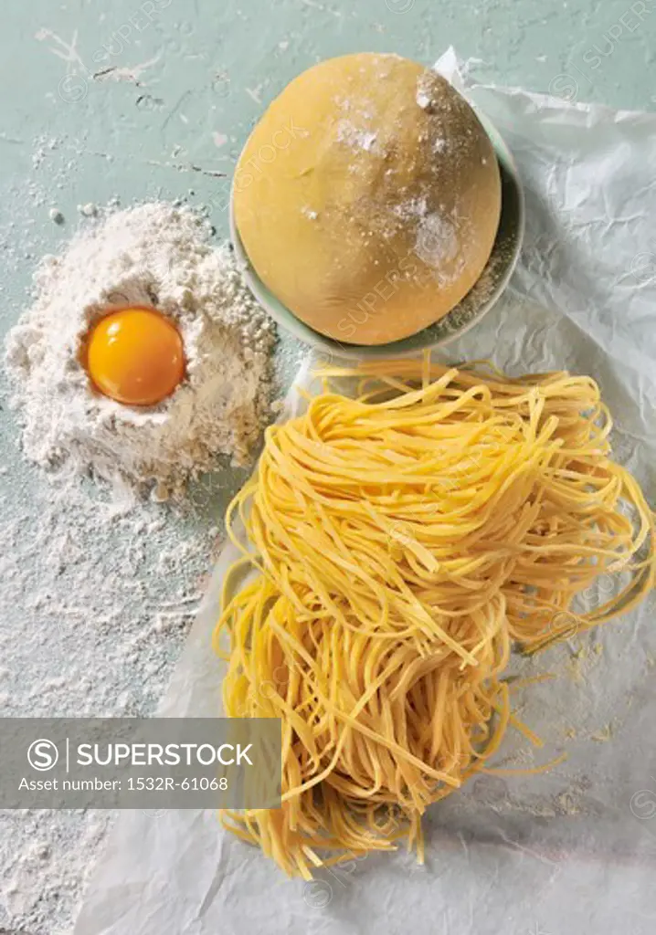Pasta dough, flour, egg and homemade tagliatelle