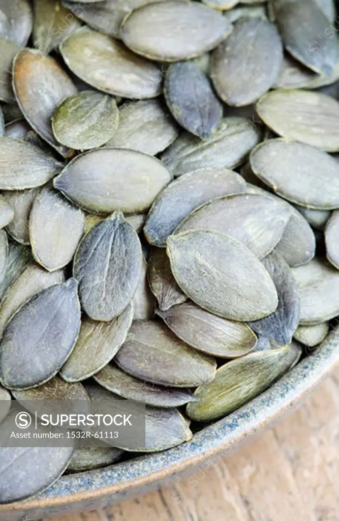 A bowl of pumpkin seeds (detail)